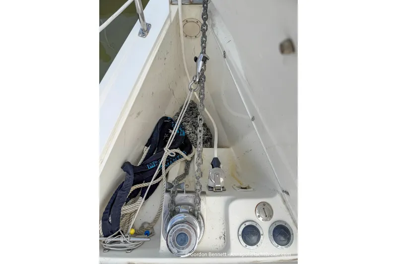Slide: The Image of Anchor locker of a 2003 Catalina 380 sailboat with chain and ropes. - 11