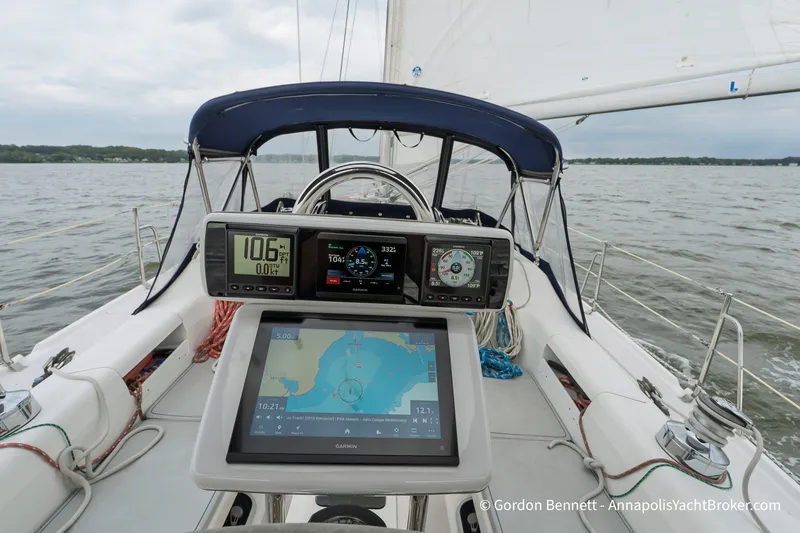 Slide: The Image of Cockpit view of 2003 Catalina 380 sailboat with navigation instruments and open water. - 21