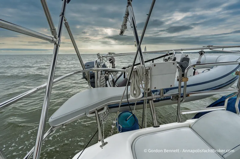 Slide: The Image of Sailboat deck view of Catalina 380, 2003 model, with ocean and cloudy sky backdrop. - 24