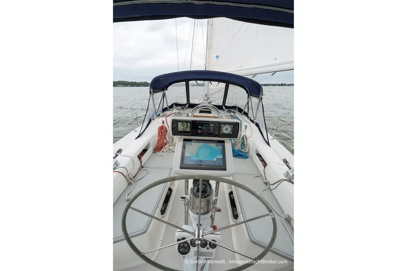 Slide: The Image of Cockpit view of 2003 Catalina 380 sailboat with navigation equipment and steering wheel. - 20