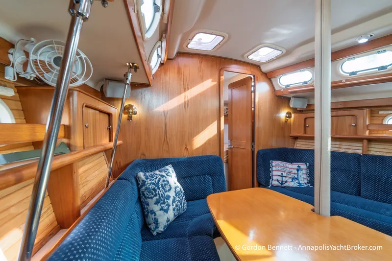 Slide: The Image of Interior of 2003 Catalina 380 yacht with cozy seating and wooden finishes. - 38