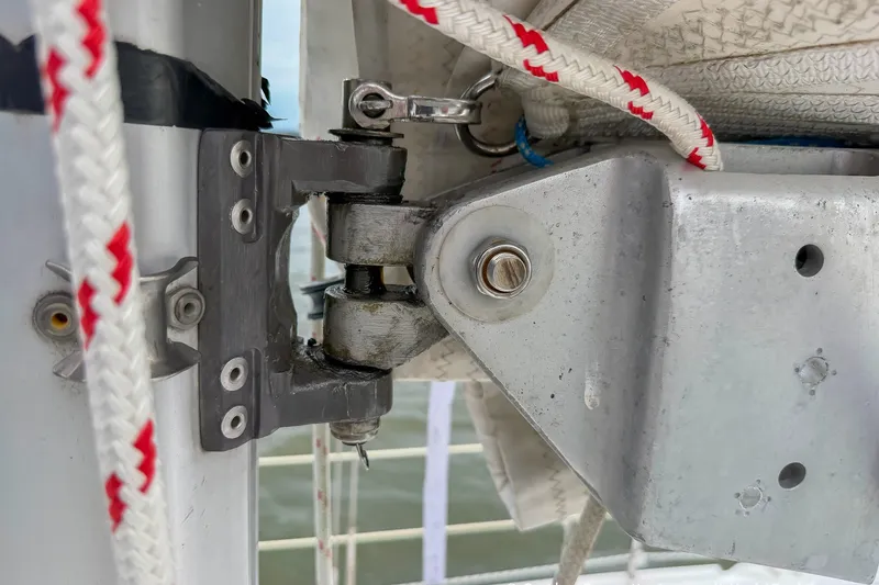 Slide: The Image of Close-up of a Catalina 380 sailboat rigging component, showcasing detailed hardware and ropes. - 17