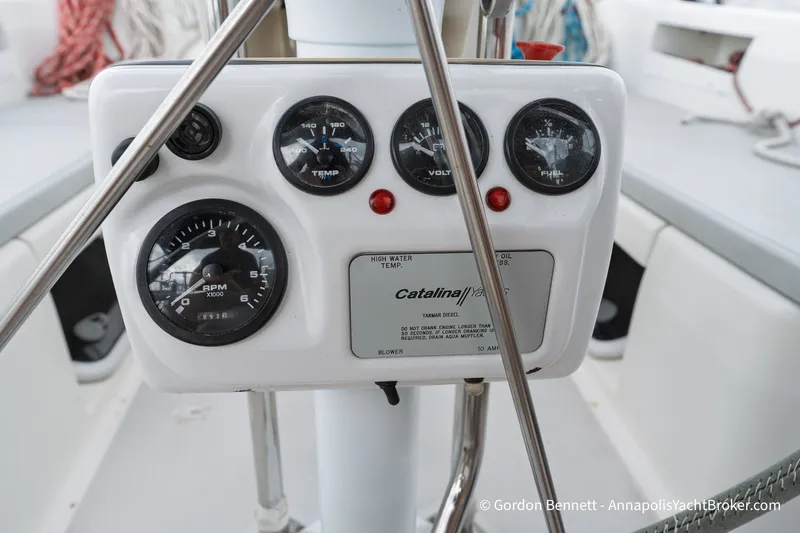 Slide: The Image of Control panel of a 2003 Catalina 380 yacht with gauges and indicators. - 57