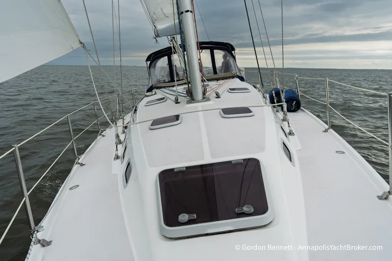Slide: The Image of Sailing on a 2003 Catalina 380 yacht, open sea view, cloudy sky. - 13