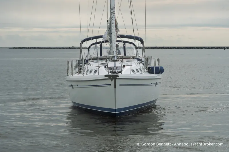 Slide: The Image of Front view of a 2003 Catalina 380 yacht on calm waters. - 5