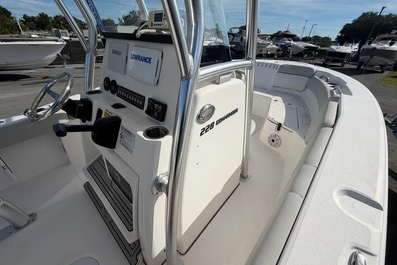 Slide: The Image of 2020 Sea Fox 228 Commander boat interior with steering console and seating area. - 13