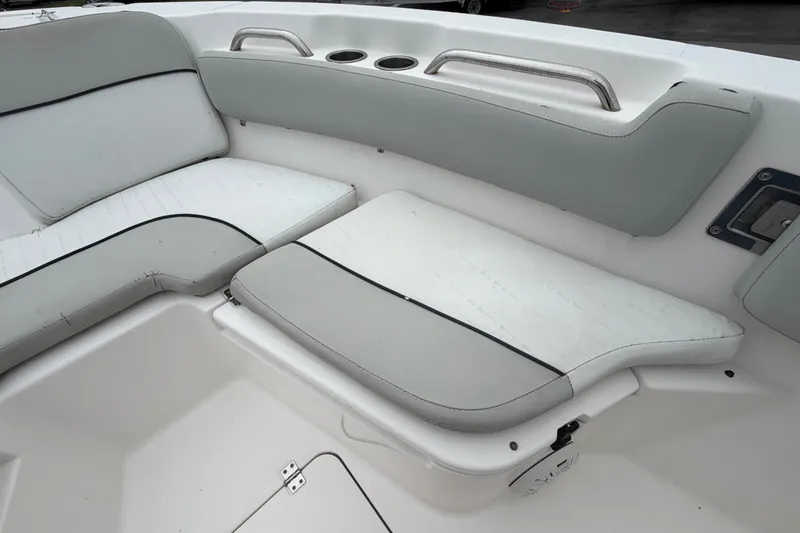 Slide: The Image of 2020 Sea Fox 228 Commander boat interior seating with cup holders and stainless steel handles. - 45