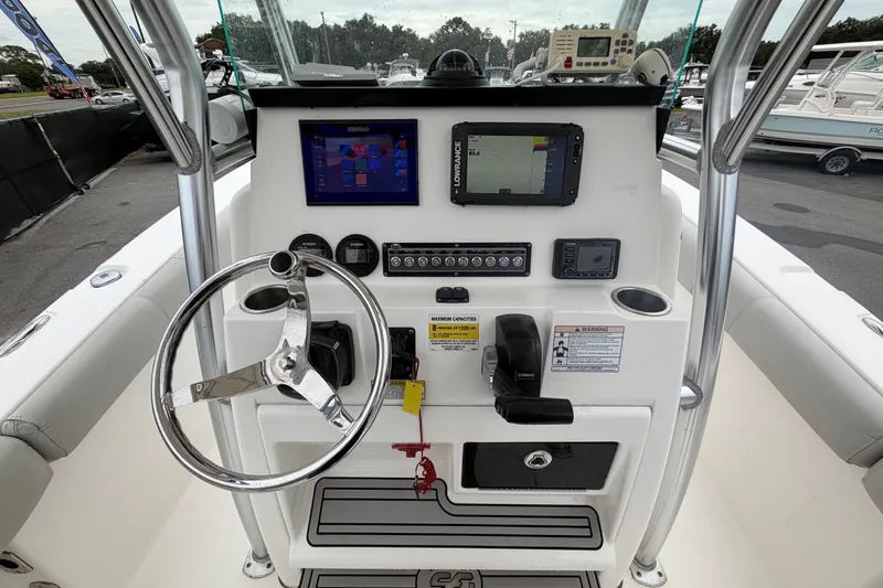 Slide: The Image of Center console of 2020 Sea Fox 228 Commander boat with steering wheel and navigation displays. - 22
