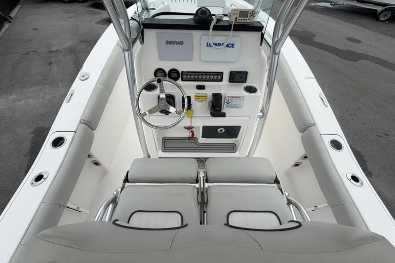 Slide: The Image of 2020 Sea Fox 228 Commander boat cockpit with steering wheel and navigation controls. - 18