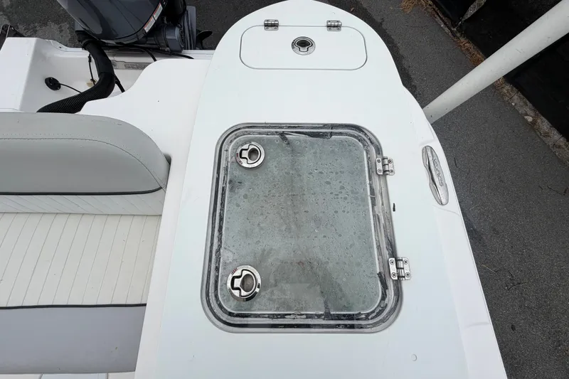 Slide: The Image of 2020 Sea Fox 228 Commander boat deck with storage hatch and seating. - 66