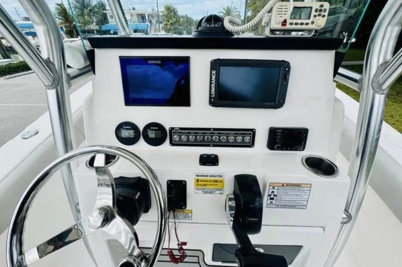 Slide: The Image of 2020 Sea Fox 228 Commander boat dashboard with steering wheel and navigation equipment. - 5