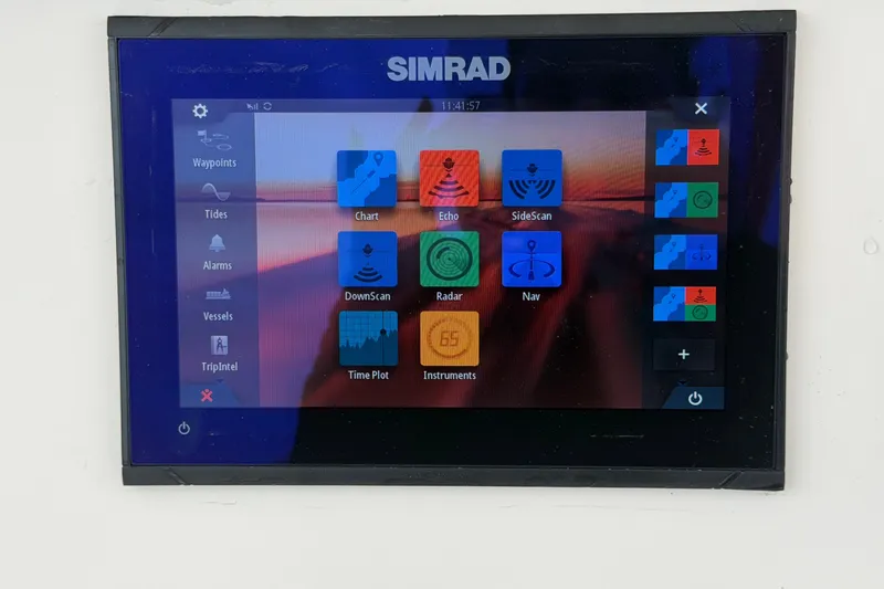 Slide: The Image of A Simrad screen displaying various navigation and boat control options. - 23