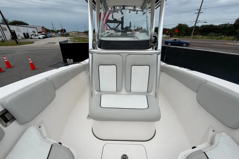 Slide: The Image of 2020 Sea Fox 228 Commander boat interior with cushioned seating and center console. - 53