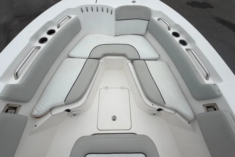 Slide: The Image of The image shows the bow area of a Sea Fox 228 Commander boat with white upholstery. - 39