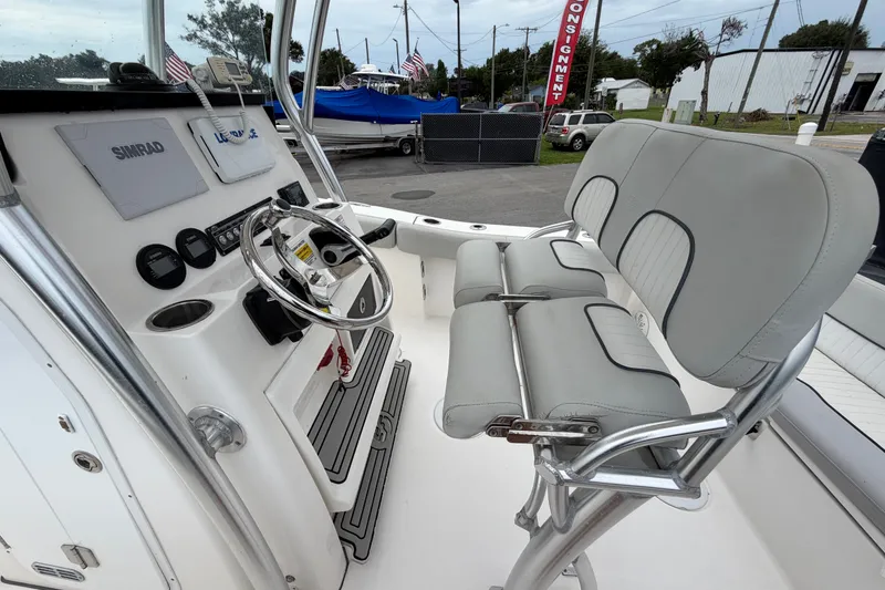 Slide: The Image of 2020 Sea Fox 228 Commander boat interior with steering console and cushioned seating. - 19