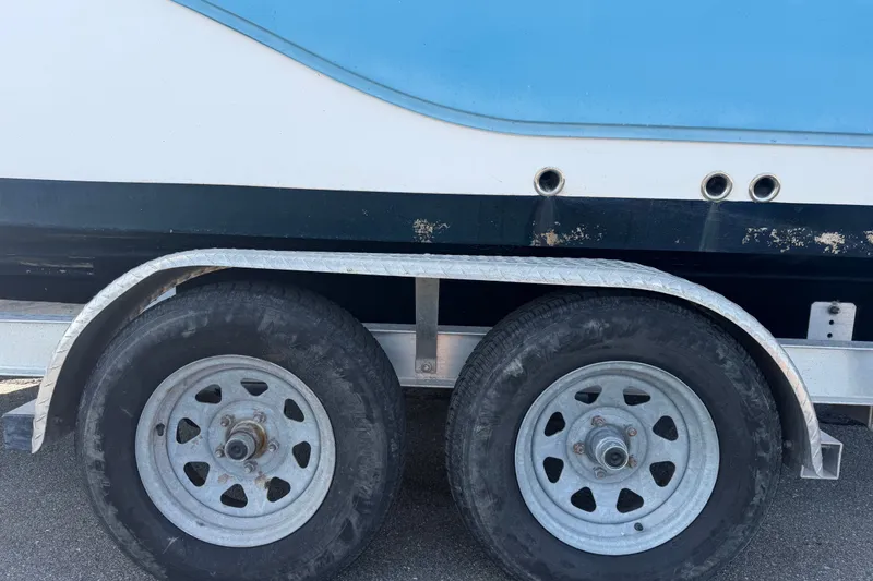 Slide: The Image of Trailer with dual wheels carrying a 2020 Sea Fox 228 Commander boat. - 21