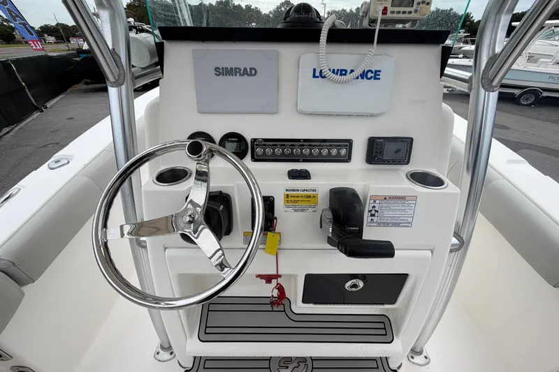 Slide: The Image of 2020 Sea Fox 228 Commander boat console with steering wheel and navigation equipment. - 21