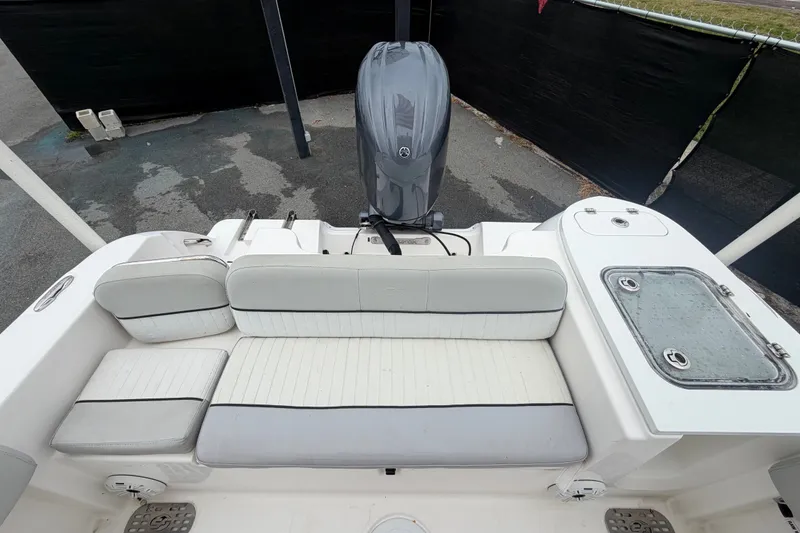 Slide: The Image of 2020 Sea Fox 228 Commander boat interior with seating and engine view. - 60