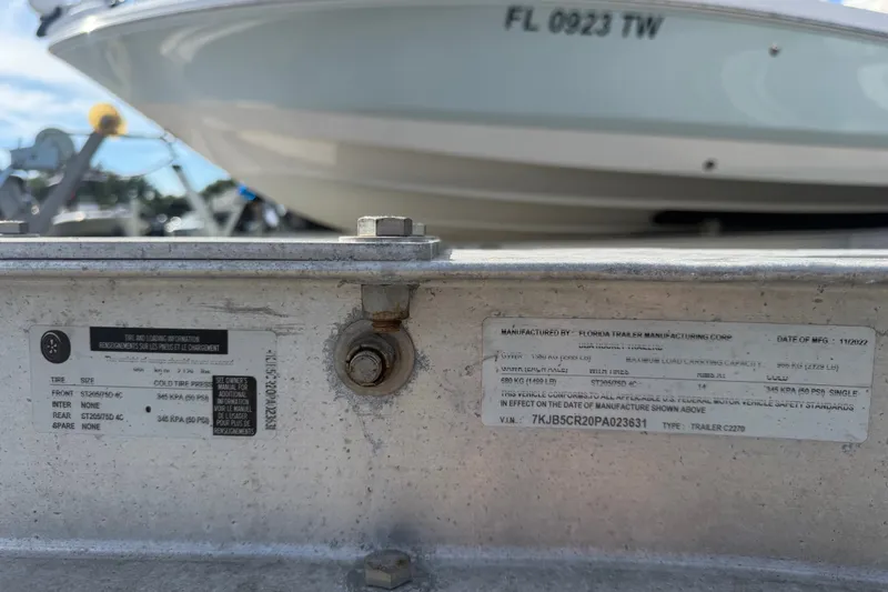 Slide: The Image of Trailer information plate with Sea Fox 228 Commander boat in background, Florida registration visible. - 19