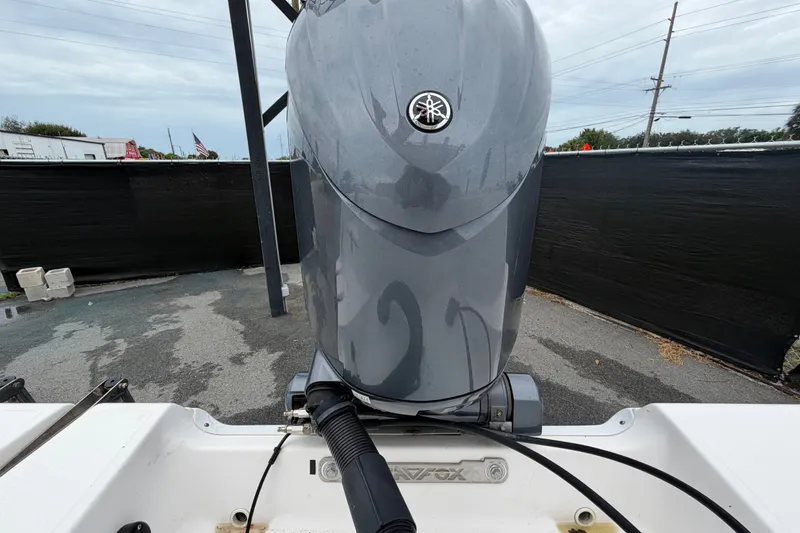 Slide: The Image of 2020 Sea Fox 228 Commander boat with Yamaha outboard motor, parked outdoors. - 74