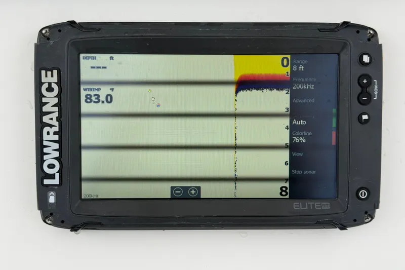 Slide: The Image of Lowrance Elite 9Ti fishfinder display on 2020 Sea Fox 228 Commander, showing water temperature and sonar data. - 24