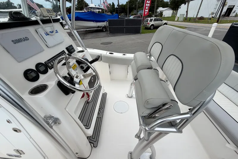 Slide: The Image of 2020 Sea Fox 228 Commander boat interior with steering wheel and seating. - 20