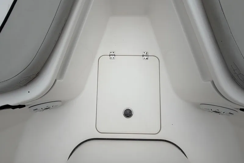 Slide: The Image of The image shows the bow area of a Sea Fox 228 Commander boat with a central storage hatch. - 41
