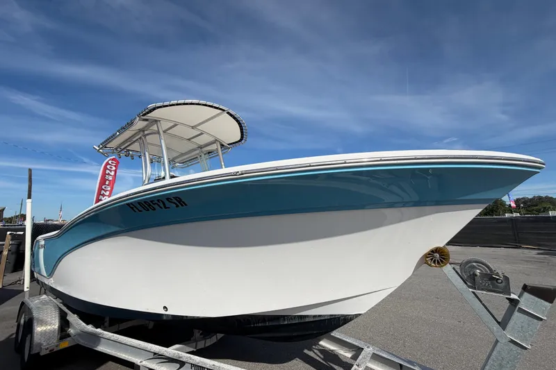 Slide: The Image of 2020 Sea Fox 228 Commander boat on trailer under clear blue sky. - 6