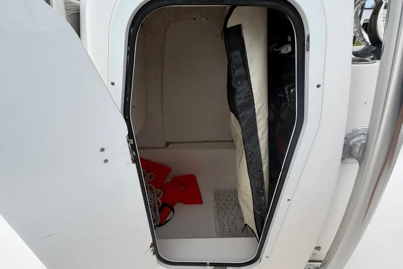 Slide: The Image of Open storage compartment on 2020 Sea Fox 228 Commander boat, showing interior space. - 35