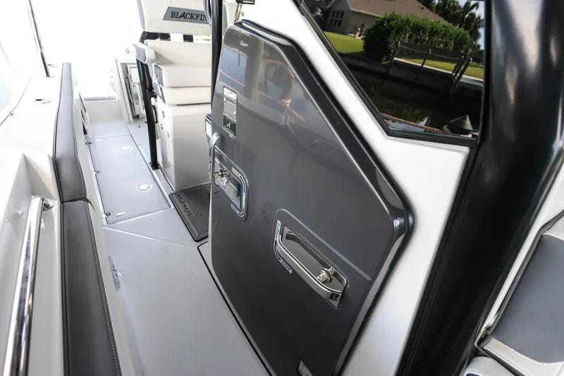 Slide: The Image of 2019 Blackfin 272 CC boat interior with sleek seating and storage compartments. - 18
