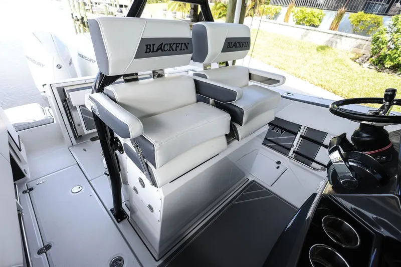 Slide: The Image of 2019 Blackfin 272 CC boat interior with dual seats and steering wheel. - 19