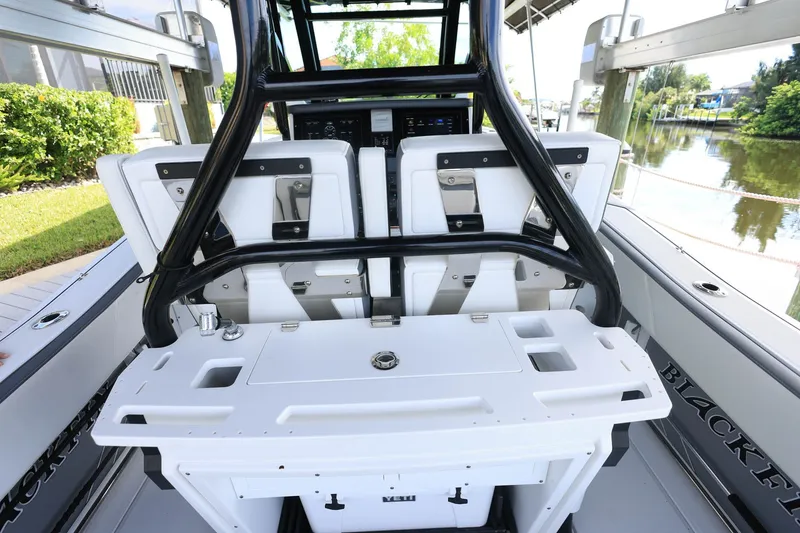 Slide: The Image of 2019 Blackfin 272 CC boat interior with seating and control panel. - 9