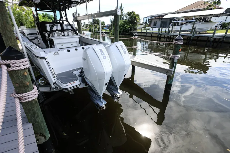 Slide: The Image of 2019 Blackfin 272 CC boat docked with dual Mercury outboard engines. - 3