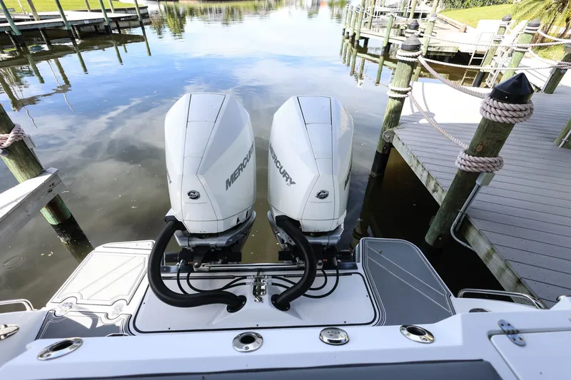 Slide: The Image of 2019 Blackfin 272 CC boat with twin Mercury outboard engines at dock. - 4