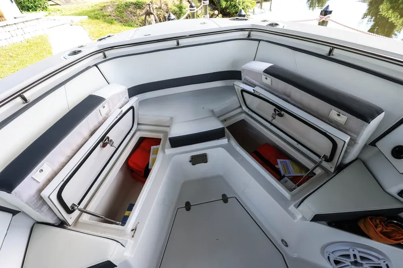 Slide: The Image of 2019 Blackfin 272 CC boat interior with open storage compartments and seating. - 14