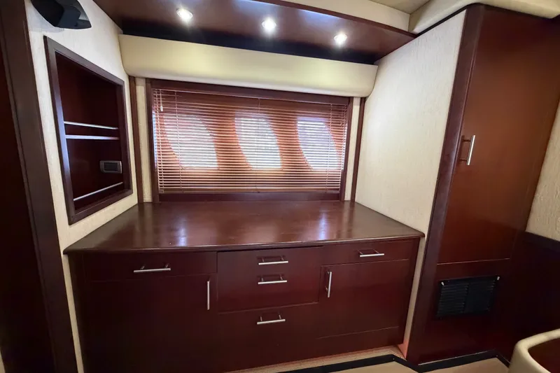 Slide: The Image of Luxurious interior of 2006 Sea Ray 60 Sundancer yacht with wooden cabinetry and blinds. - 26