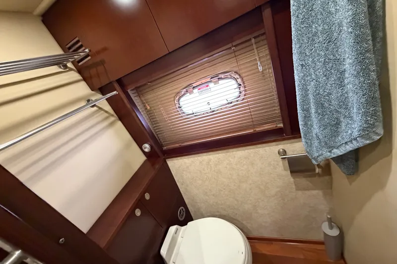 Slide: The Image of Bathroom interior of 2006 Sea Ray 60 Sundancer yacht with towel rack and window blinds. - 20