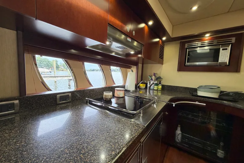 Slide: The Image of Luxurious kitchen interior of 2006 Sea Ray 60 Sundancer yacht with modern appliances. - 34