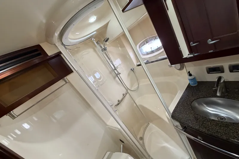 Slide: The Image of Luxurious bathroom in 2006 Sea Ray 60 Sundancer yacht with shower and sink. - 16