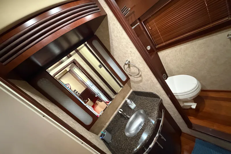 Slide: The Image of Luxurious bathroom interior of 2006 Sea Ray 60 Sundancer yacht with modern fixtures. - 25