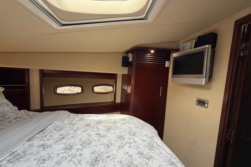 Slide: The Image of Luxurious cabin interior of 2006 Sea Ray 60 Sundancer yacht with cozy bedding. - 18