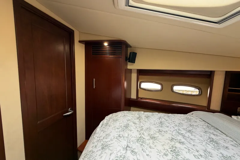 Slide: The Image of Luxurious cabin interior of 2006 Sea Ray 60 Sundancer yacht with elegant wood finishes. - 19