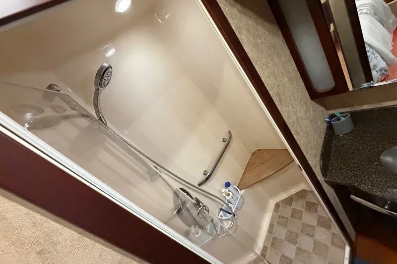 Slide: The Image of Luxurious bathroom in 2006 Sea Ray 60 Sundancer yacht with modern shower amenities. - 21