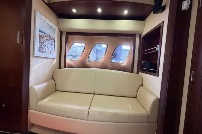 Slide: The Image of Luxurious interior of 2006 Sea Ray 60 Sundancer yacht with cream sofa and wooden accents. - 27
