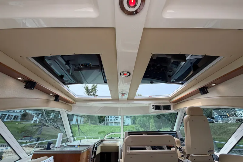 Slide: The Image of Interior view of 2006 Sea Ray 60 Sundancer yacht with sunroof and helm station. - 48