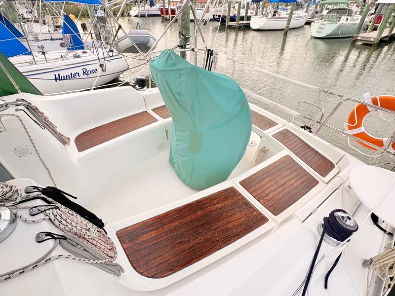 Slide: The Image of The cockpit of a 2005 Beneteau Oceanis Clipper 343 with wood decking and a covered helm. - 5