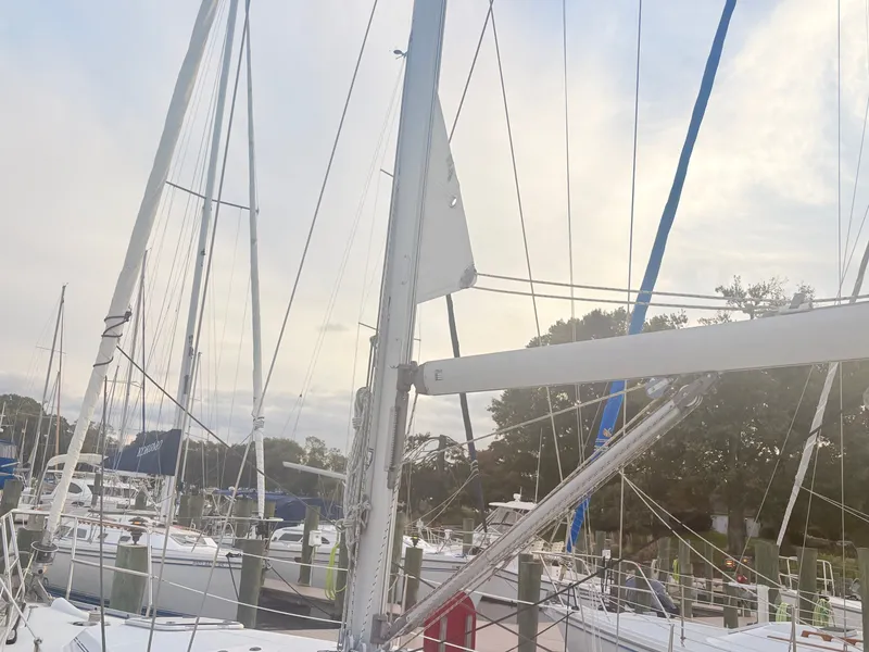 Slide: The Image of Sailboat in harbor with masts and rigging, surrounded by other boats. - 46