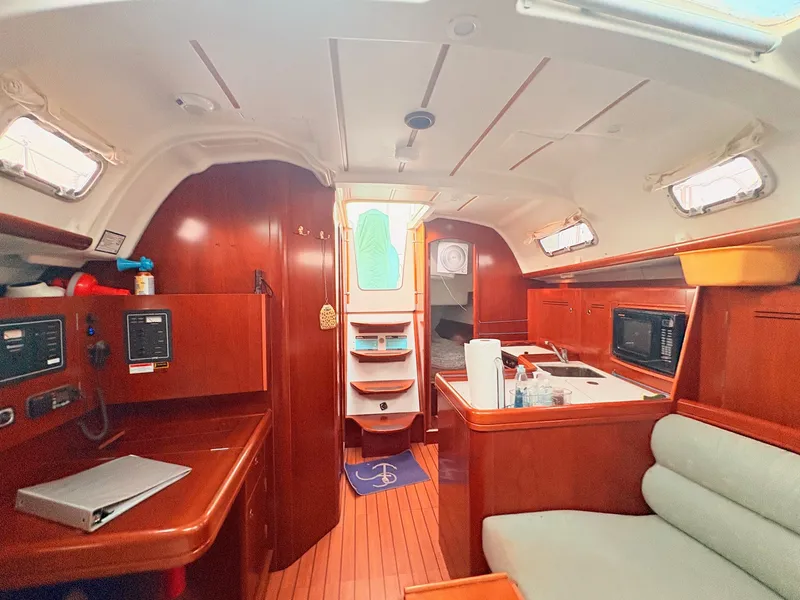 Slide: The Image of Interior of a 2005 Beneteau Oceanis Clipper 343 with wood finish and galley. - 40