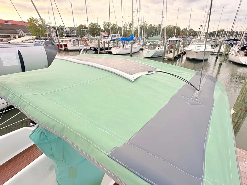 Slide: The Image of The 2005 Beneteau Oceanis Clipper 343 is docked. A green Bimini top is visible. - 4