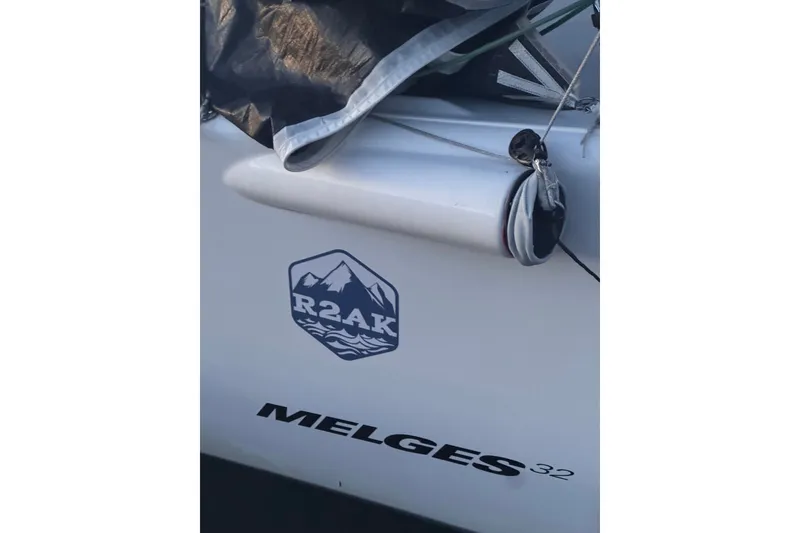 Slide: The Image of 2008 Melges 32 sailboat with R2AK logo, featuring rigging details. - 11